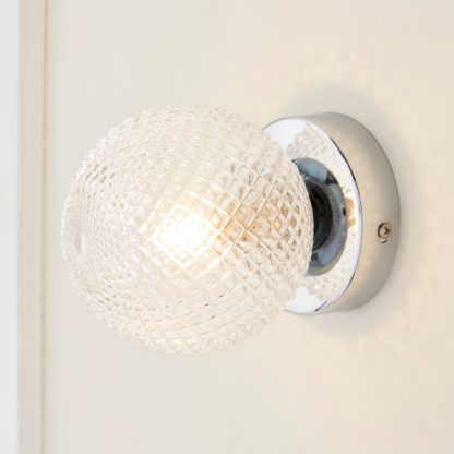 An Image of Vaughn Globe Glass Wall Light Silver