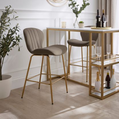 0c16963d99c31e62a4d4ec881be6ccffe03dff005eb8602bc49e6b0d333c89ea.jpg An Image of Lila Counter Height Bar Stool, Velvet Velvet Bottle Green