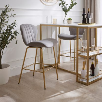 220a59f2b66f754ae0f26eb5c7c0c1b8e9946d99d7c62302a45c88bc5be0f2ee.jpg An Image of Lila Counter Height Bar Stool, Velvet Velvet Bottle Green