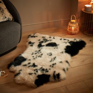 An Image of Cow Hide Print Faux Fur Rug White