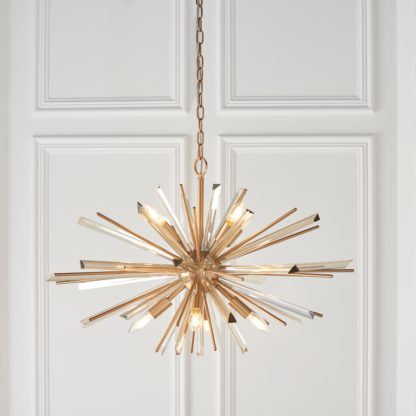 An Image of Vogue Orion 8 Light Pendant Light Brass