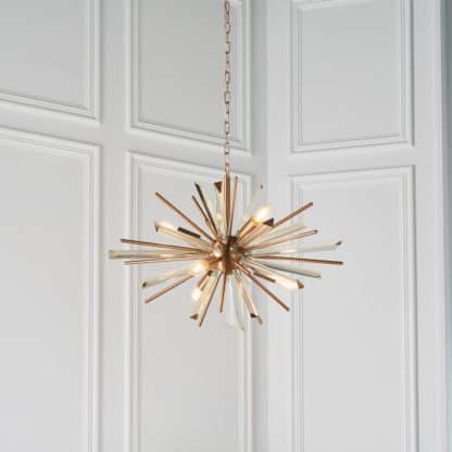 An Image of Vogue Orion 8 Light Pendant Light Brass