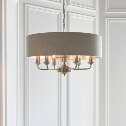 d20791c7233f66e42173e83dc5e5293715862a35b54de3113db176833c500c80.jpg An Image of Vogue Sandringham 6 Light Pendant Light Chrome