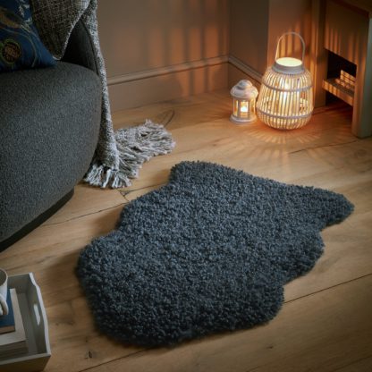 An Image of Curly Faux Fur Rug Green