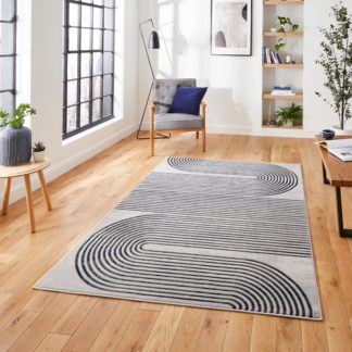 An Image of Apollo Swirl Washable Rug Navy (Blue)