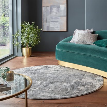 606bc143b2a2f4e15b6748101fac48b6d83cbecc84c7f317b75b92065b360db1.jpg An Image of Wonderlust Round Rug Wonderlust Dark Blue