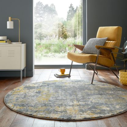 95989a8e4742459cb170b54c96f644a76954141fcc12ed76ba79ecad515eb93a.jpg An Image of Wonderlust Round Rug Wonderlust Dark Blue