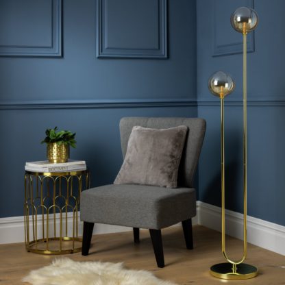 f50294bd636c70f9e3bc56c426e60efbd6caa53b0e2693f72e36b9e3289fff77.jpg An Image of Habitat Ombre Floor Lamp - Champagne