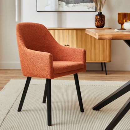 287052fb88fe76ba1ad69e748b87a81526972d8df10f982e43860bf4b74b0b0e.jpg An Image of Eddie Boucle Carver Dining Chair Boucle Orange Umber