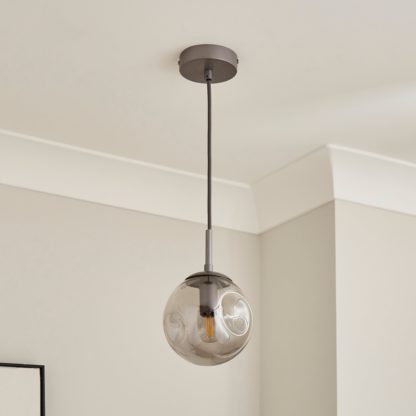 3667e40948816d9fb25f96cfcc0538262485f35a4515bb5de40fb71178b0b352.jpg An Image of Alexis Glass Adjustable Ceiling Light Blue