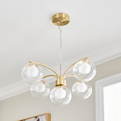 cd5e7d1dc626da3eae51d814942e08eb56e88a77a77abc24cf5d26d47e6b3ea7.jpg An Image of Leirah Ribbed 5 Light Ceiling Light Gold