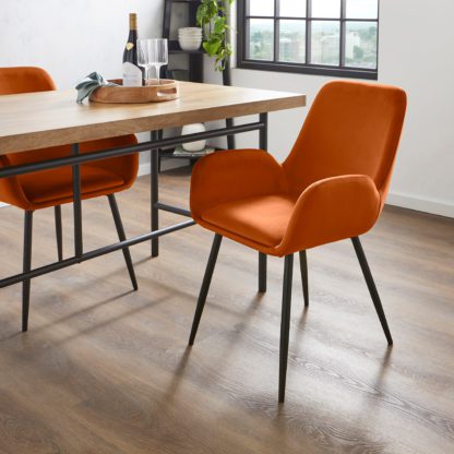 e924ee99eccc30fa0d39c54aebde13dd09b3838fbc0b0d958eed0ba4111299e7.jpg An Image of Axel Velvet Dining Chair Orange Umber