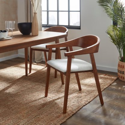 196e460f316b81ec9dcdd54346c4127598854a215c312246262b39453ca5f0cd.jpg An Image of Oskar Dining Chair, Boucle Black Stained Wood