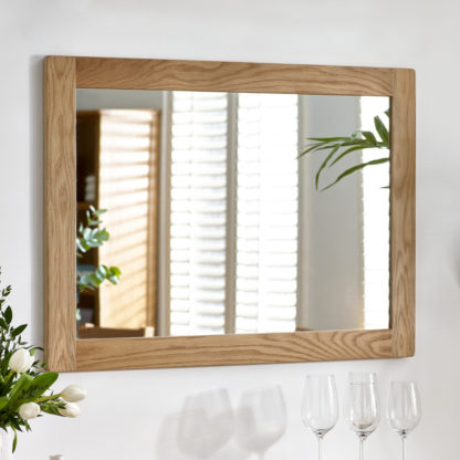 27f55df61992f9489cacb5beaa71c89790b4658ceb9ee7c0d5a72023396993ff.jpg An Image of Mallory - Wall Mirror - Oak - Wooden