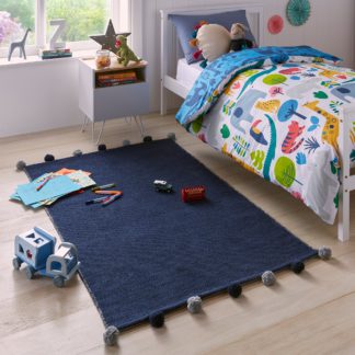 An Image of Reversible Pom Pom Rug Blue