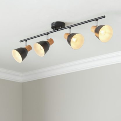 9b9b75d904d2f972ddc6657c521ea1599dde7f8e84552ced08b6c87bd3a17c47.jpg An Image of Camber Lighting Larren Metal 4 Light Spotlight Bar - Black