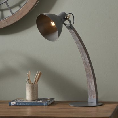 f4e399f697771698513dea98cfedf18328c9a21b93a90adad4f47776e7ae5274.jpg An Image of Topsham Wood and Grey Metal Curved Table Task Lamp Black