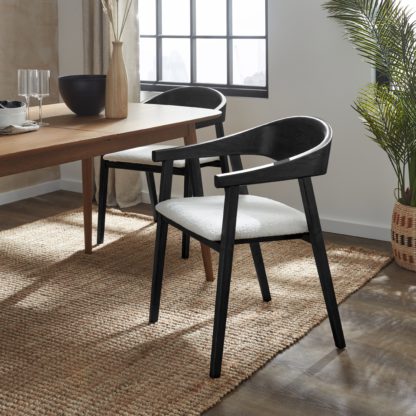 f9b71fac00ed38d7b09ae58fff5f8d84b3b2b85a1aff786bcbf0a753f2208ce2.jpg An Image of Oskar Dining Chair, Boucle Black Stained Wood