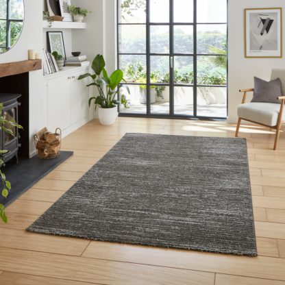 fe249dfe39521193f4fbb77fbfc1a853da46f420c6548ec4b09af55010fc2fe4.jpg An Image of Flores Ribbed Washable Rug Charcoal