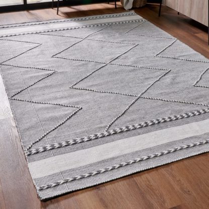 6a9241702f38d01da18ea1ad6862ca6655eb188f8bafeab5738a2555ebbf5e35.jpg An Image of Plaited Stripe Rectangular Rug Grey