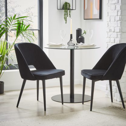 8a620a22e010abfaac01cb26efac9b5d35edd2deaec590342c0d2036f6220f79.jpg An Image of Lillia Velvet Dining Chair Navy