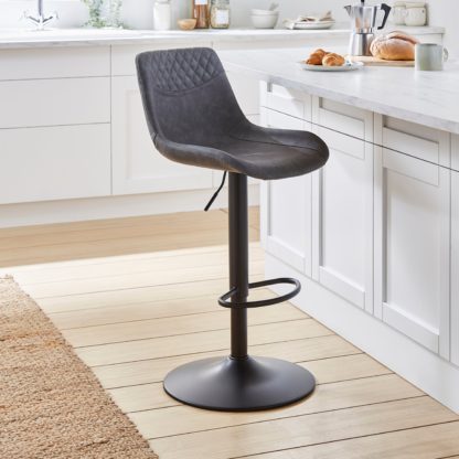 933fa6bc61f70636836cfcbc531b0811b17ac32e2a4381b530d0aa0dcf9b0eb6.jpg An Image of Walden Height Adjustable Bar Stool, Faux Leather Tan