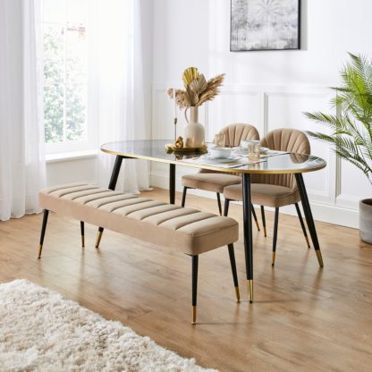 396c67ef443ae7d472a0260452f0930209fd5f3db325522dc43eb5b3881ee062.jpg An Image of Sylvia Oval Dining Table with Sylvia Black Velvet Dining Bench & Chairs