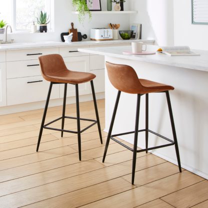 5846194172200f6881d0f1f9c15f65a8a9eb17c5b0b989ddae9b5f0b589fa541.jpg An Image of Jayden Counter Height Bar Stool Tan
