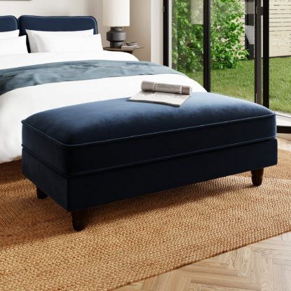5cbfa2a541e0525868a63de64214c22c6bf8b9c4b87da0739012485024c44670.jpg An Image of Beatrice Matte Velvet Long Footstool with Storage Luxe Navy