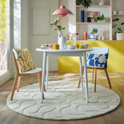 78d96814e64c9b08b85a51ccb918ff1c6a9781c1399041ea57546f579041f3ce.jpg An Image of Elements Wigley Wool Round Rug Cream