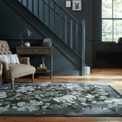 8d54e220299dfdd3dfb05a3bfba1df17edd37ee9ef58b98f6eef59984f6908b9.jpg An Image of Liana Floral Chenille Rug Blue