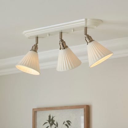 dc1940349176f6950882bc7cfb16f020fdd4c2b1cae31c350d395b36bccfa857.jpg An Image of Lilbourne Ribbed Ceramic 3 Light Adjustable Flush Spotlight White