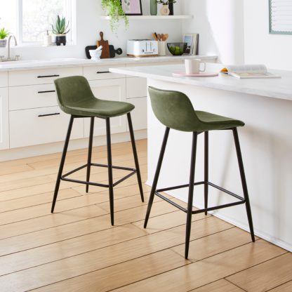 facebec5e3e5a371ae568dd9fb016afbc62b1cd1d6ef0861ad7e832e79084f79.jpg An Image of Jayden Counter Height Bar Stool Tan