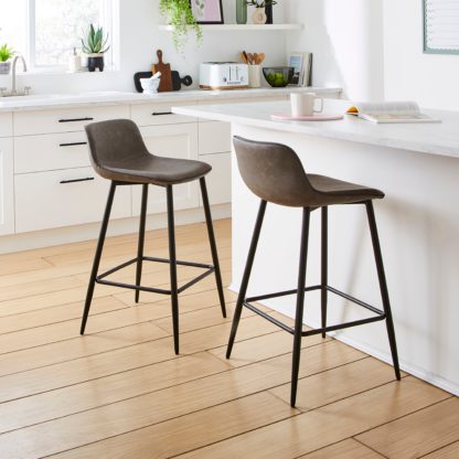 ffafd98b33416082a9cd35dc85beff74a4da9bbcccbaba74c5251c1b2276a9f1.jpg An Image of Jayden Counter Height Bar Stool Tan