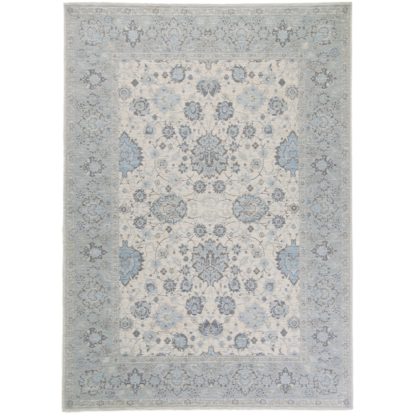 23e4e2a97ce351cfb65e192714b1b93a931efee4e6476b84593db82db3ec966b.jpg An Image of Otisse Traditional Rug Soft Blue