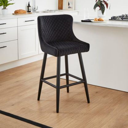 2fe7d105f6e489ce0af7802a05f34f8ca12b5358b366a17e5f9172b8f09b4fe6.jpg An Image of Montreal Counter Height Bar Stool, Velvet