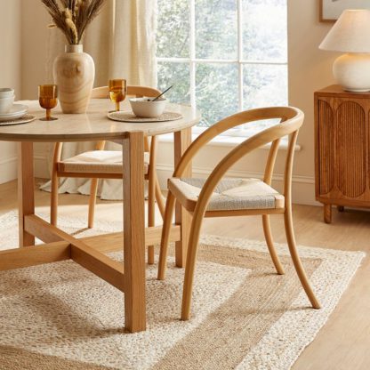 3b1256a368e060cc9f2479023afe73eadabbe1f4e2f3890889905bb7ccb91357.jpg An Image of Nancy Dining Chair