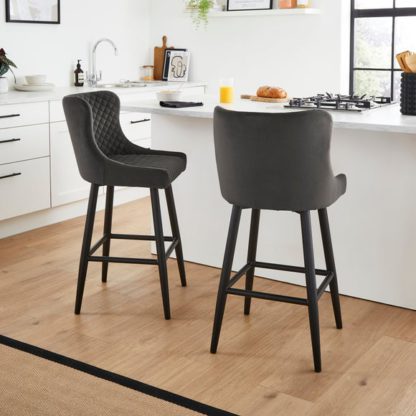3ee24fb6be44361daacfd0b16c36d749ecc407db1fa71a8fb0de7defbd8200bc.jpg An Image of Montreal Counter Height Bar Stool, Velvet