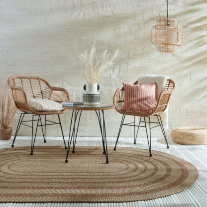 56a2e4e2874086f7b75d9c5d6cfc33417007a949f1cd732c8c9778d21e819ffa.jpg An Image of Stripe Border Indoor Outdoor Oval Rug