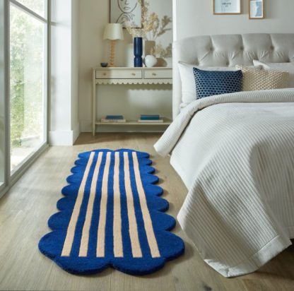 6185a3d9ba9414ab2e63d1896d1328e1a3c71c27c712afe66f757df58d4a2402.jpg An Image of Milo Scallop Wool Runner