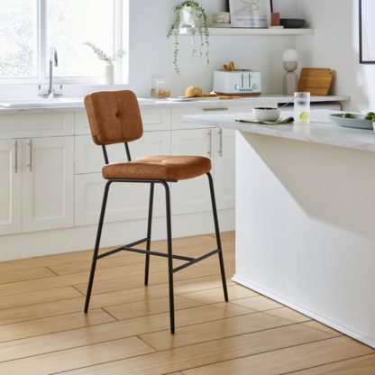 65b4f9732a194785ce00c57afd30f620dd0027123f0bb847afa86f36259ad97d.jpg An Image of Jessie Counter Height Barstool, Faux Leather