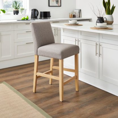 664b1f5be8eaaab8f4b7d25d866e574ce1869134266e010fde94331697f18824.jpg An Image of Oakley Counter Height Bar Stool, Tan Faux Leather