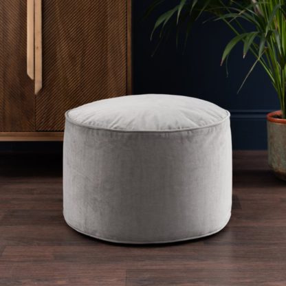 96d5be70ca29d82e4f2a3edb0c40bf5a10f7ecdc0111e2a43eee5935095c9100.jpg An Image of Eliza Velvet Pouffe