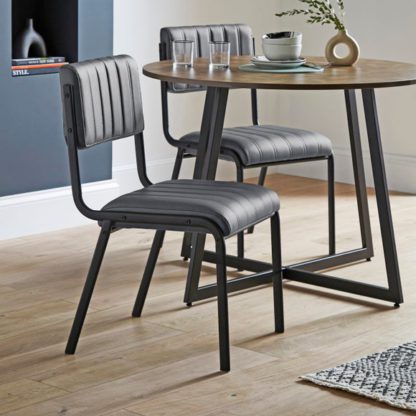 b182a6a049eea30d37fb2cdb24d3973697a8797cbc61407e9c06d8a5d3a06151.jpg An Image of Rhys Set of 2 Dining Chairs, Faux Leather