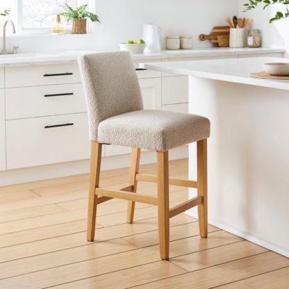 e272105be434a6565a305ed0b56fe34bb954ebbd3ddf03f960db542e04f880df.jpg An Image of Oakley Counter Height Bar Stool, Tan Faux Leather