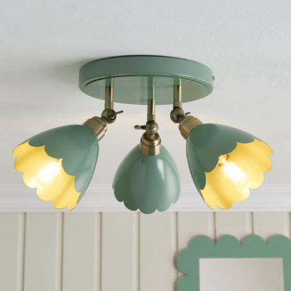ea56d19b5513714acda8d6f41ae7a5904fc3ae1d9b4ba07ff94d6a596bf99eec.jpg An Image of Remi Scalloped 3 Light Adjustable Spotlight